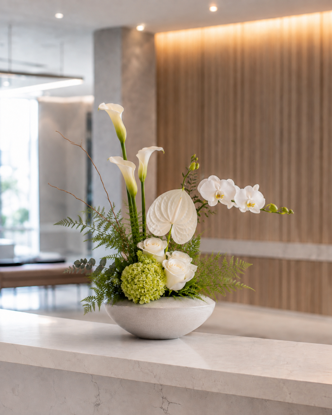 Nordic reception flower arrangement with seasonal flowers, greenery and a minimalist vase for a modern business space in Denmark