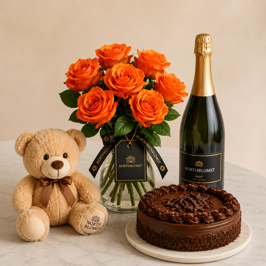 Luksuriøs orange rosenbuket med mousserende gave, chokoladekage og bamse