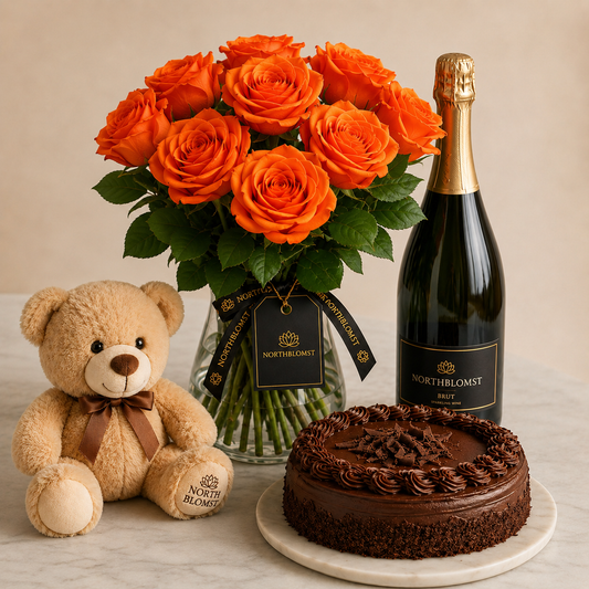 Luksuriøs orange rosenbuket med mousserende gave, chokoladekage og bamse